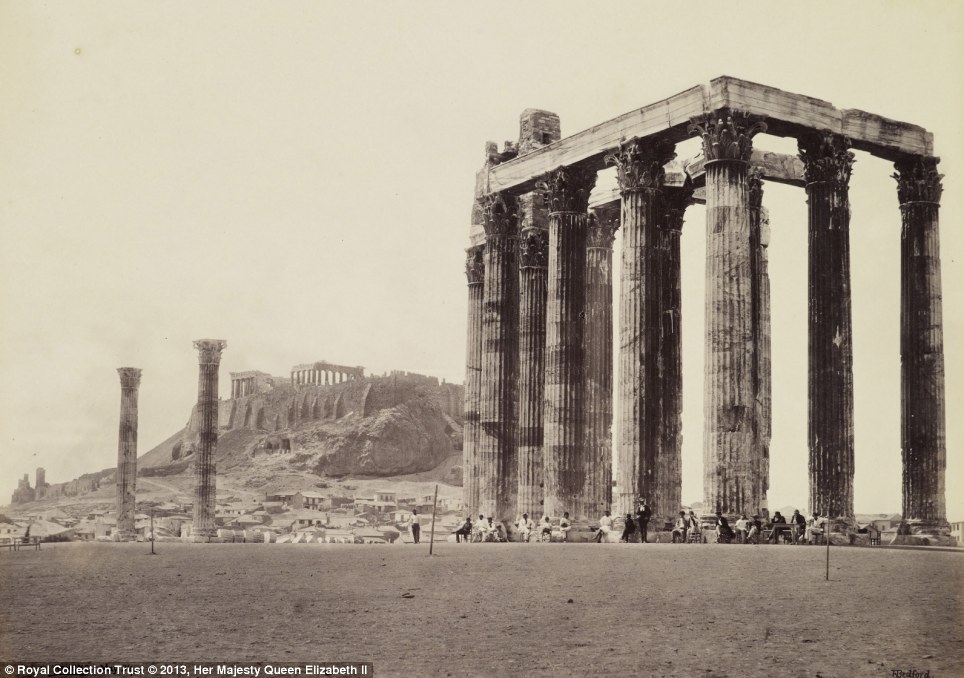 Top tables: Acropolis and the Temple of Jupiter in Athens served as a backdrop form some al fresco dining when the regal party visited Greece in late May