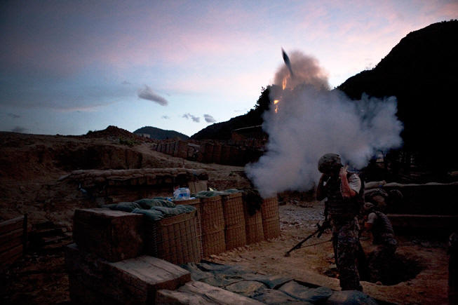 Men of Battle Company fire a mortar at insurgent positions.