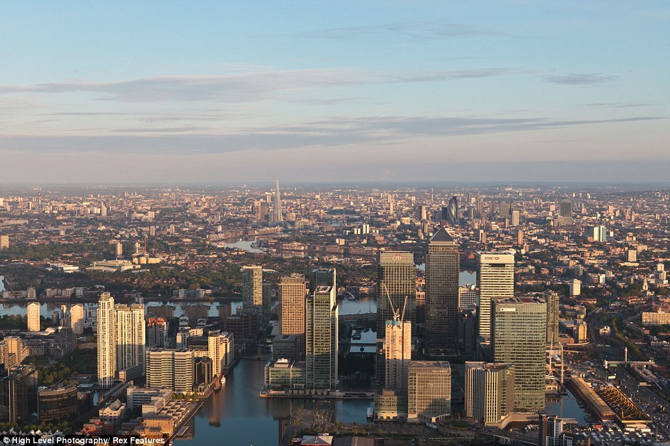 The stunning birds-eye shots also capture the Docklands at dawn, but even out in the east of London The Shard is still clearly visible