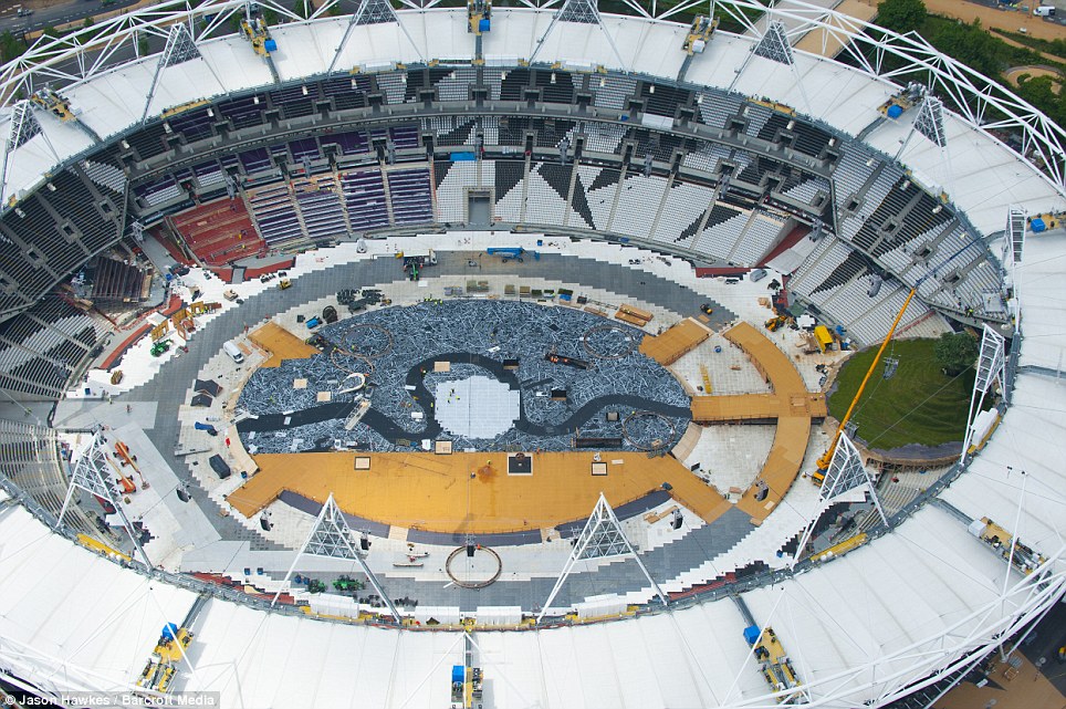 The photographs show the preparations that are underway in haste for the Olympic opening ceremony happening next month